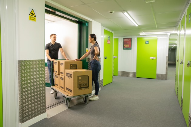 People moving into a storage unit